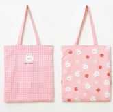 This Pink Gingham Bunny & Strawberry Tote has major cottage-core vibes! This bag is ideal for all your on-the-go tasks and adds a charming kawaii touch to any outfit! Its spacious size makes it perfect for storing laptops, and everyday essentials, or doubling as a handy grocery bag.